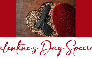 Heart-shaped box filled with bullets and a handgun on a wooden surface.